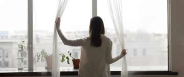 woman-looking-through-the-window